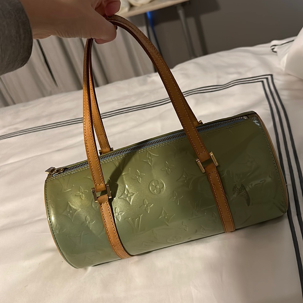 Louis Vuitton authentic bag. See picture has a ink stain on it